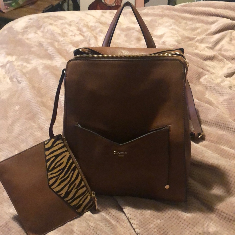 Brown leather backpack with detachable change purse.